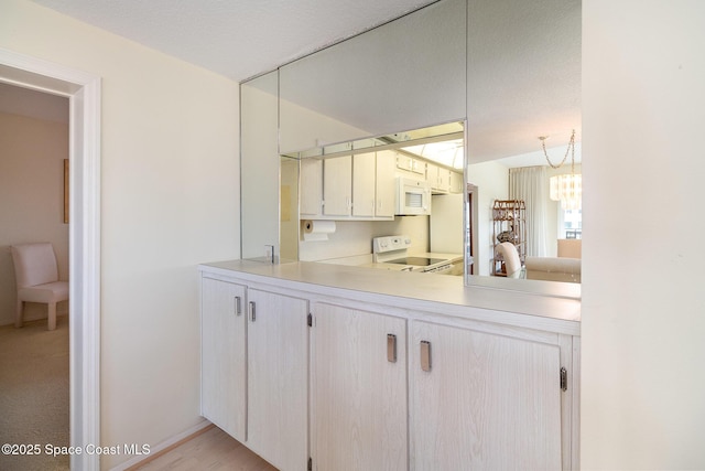 bathroom with an inviting chandelier