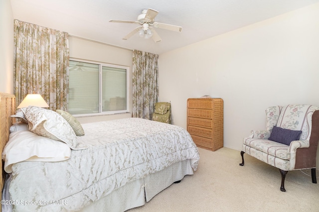 bedroom featuring ceiling fan and light colored carpet