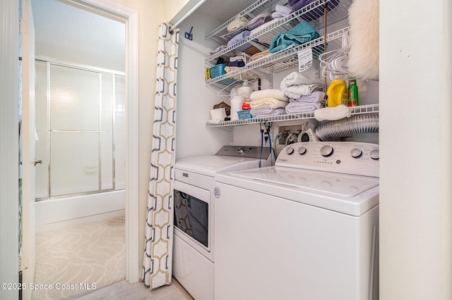 clothes washing area with laundry area and independent washer and dryer