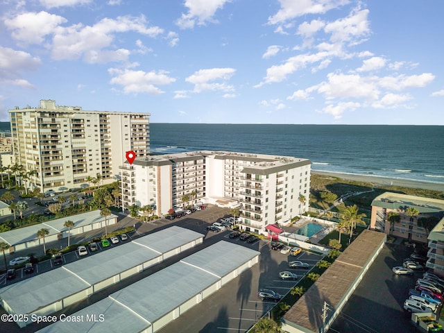 aerial view featuring a water view and a beach view