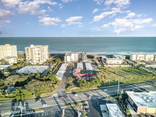 birds eye view of property with a view of city and a water view