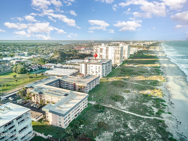 bird's eye view with a view of city, a water view, and a beach view