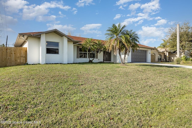 ranch-style house featuring a garage and a front lawn