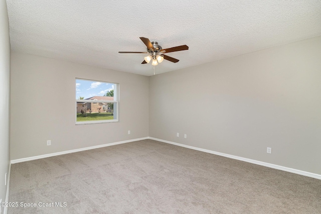 unfurnished room with a textured ceiling, light colored carpet, and ceiling fan