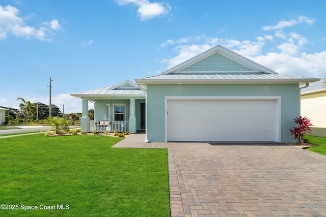 view of front of property with a porch, a garage, and a front yard