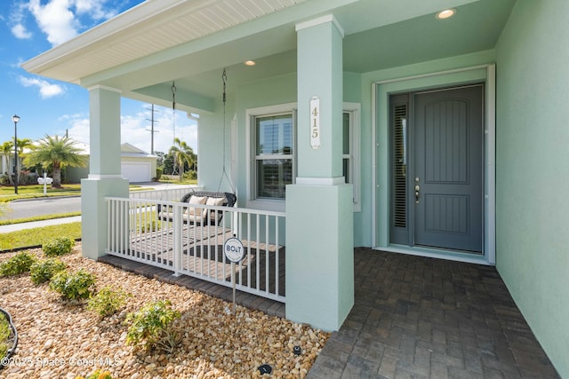 entrance to property with covered porch