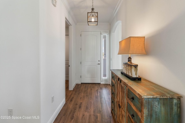 entrance foyer featuring dark hardwood / wood-style flooring and crown molding