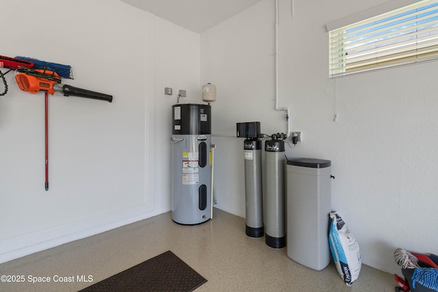 utility room featuring water heater