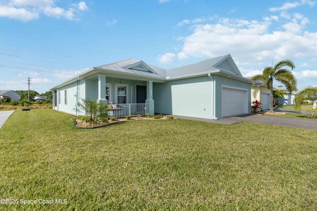 single story home featuring a garage, covered porch, and a front yard