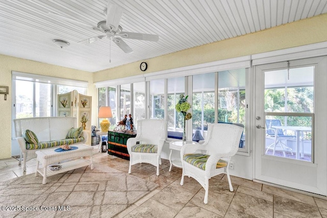 sunroom / solarium with ceiling fan