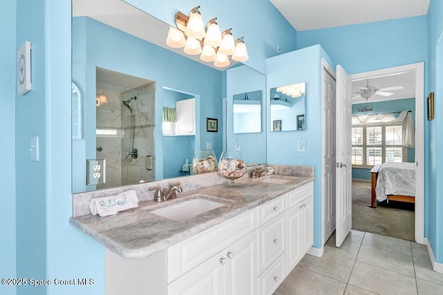 bathroom with tile patterned flooring, vanity, ceiling fan, and a shower with shower door