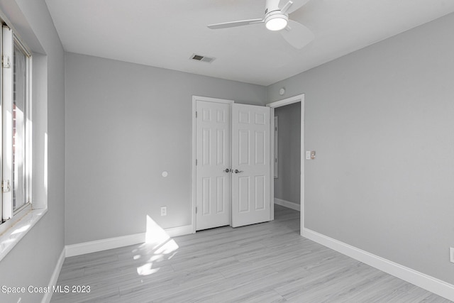 unfurnished bedroom with light hardwood / wood-style flooring and ceiling fan