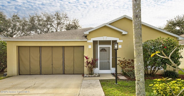 ranch-style home featuring a garage