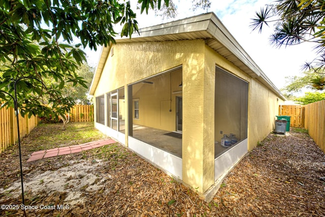 view of side of property with a sunroom