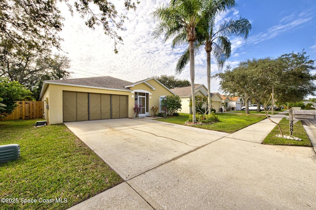 ranch-style home with a front lawn and a garage