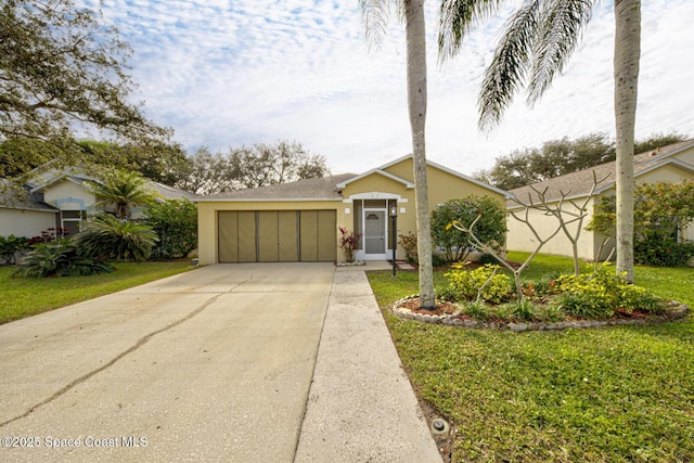 view of front of house featuring a garage and a front yard