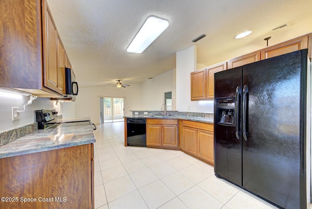 kitchen with sink, a textured ceiling, ceiling fan, and black appliances