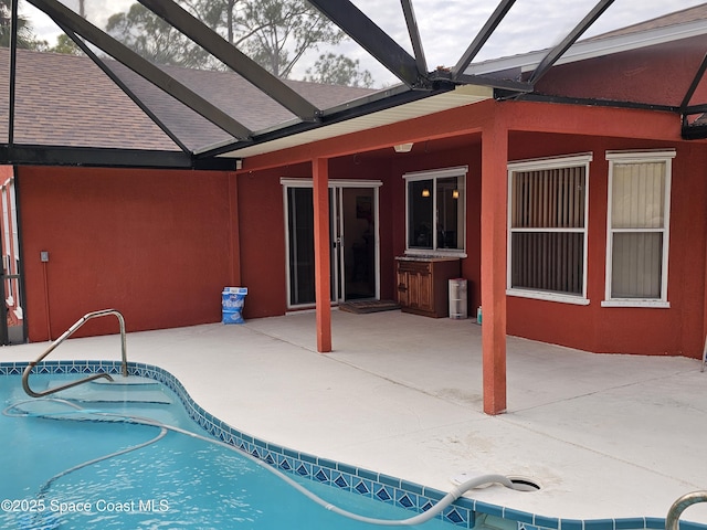 view of pool featuring a lanai and a patio