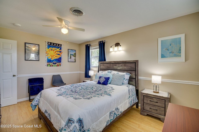 bedroom with ceiling fan and light hardwood / wood-style flooring