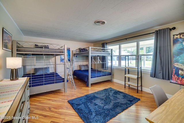 bedroom with light hardwood / wood-style floors