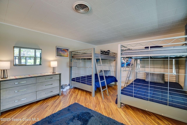 bedroom with light hardwood / wood-style flooring