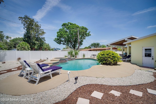 view of swimming pool featuring an in ground hot tub and a patio