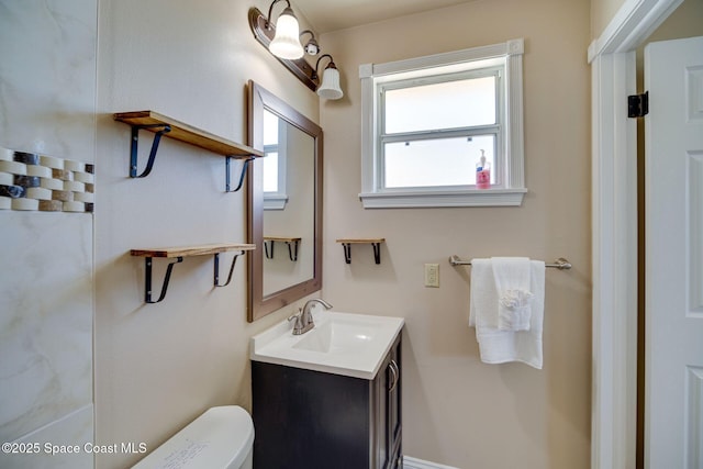 bathroom with vanity and toilet