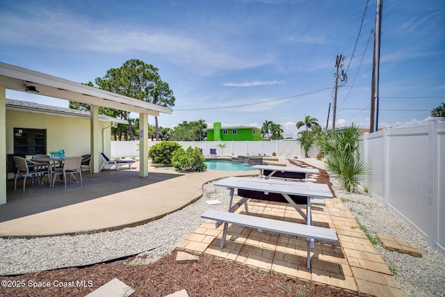 view of patio with a fenced in pool