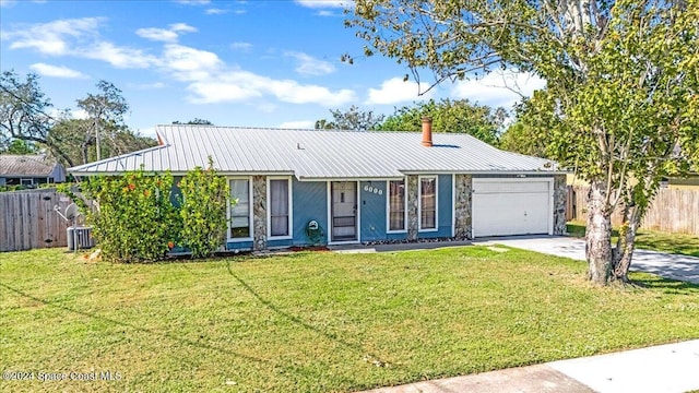 single story home with a front lawn and a garage