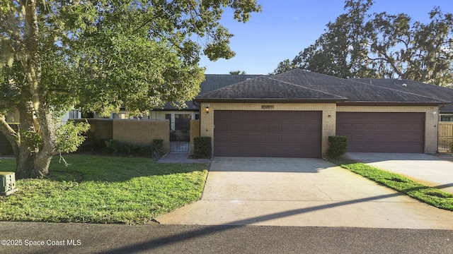 view of front facade featuring a garage and a front lawn