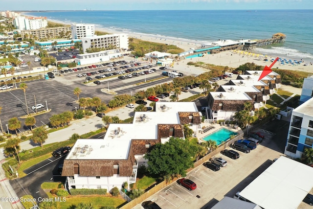 aerial view featuring a water view and a beach view