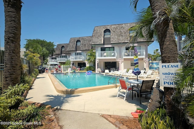 view of pool featuring a patio