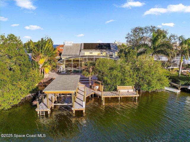 dock area featuring a water view and a lanai