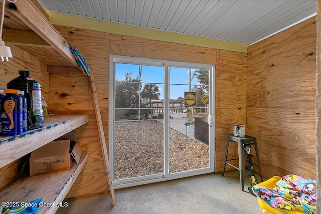 doorway with carpet flooring