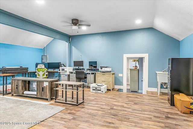 office featuring wood-type flooring, lofted ceiling, and ceiling fan