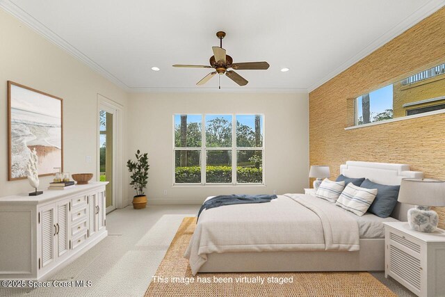 carpeted bedroom featuring ceiling fan and ornamental molding