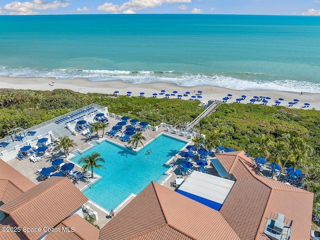 bird's eye view featuring a view of the beach and a water view