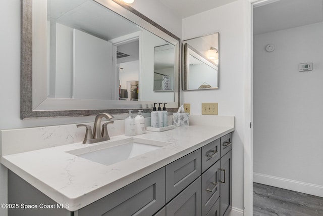 bathroom featuring vanity and hardwood / wood-style flooring