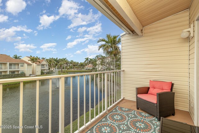 balcony featuring a water view