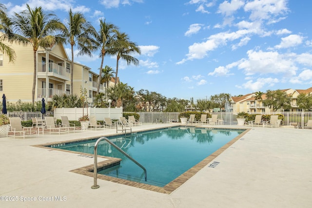 view of swimming pool with a patio