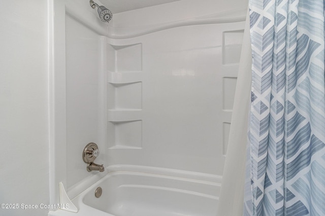 bathroom with shower / bath combo