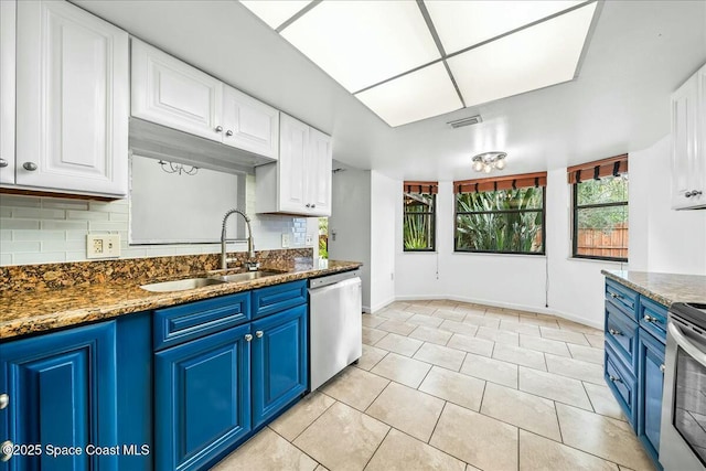 kitchen featuring white cabinetry, blue cabinetry, and appliances with stainless steel finishes