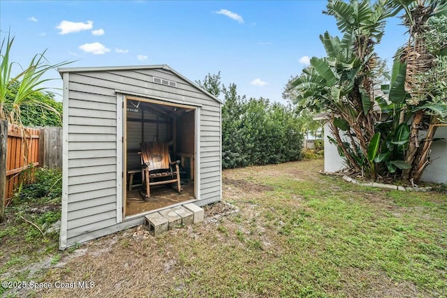 view of outdoor structure with a lawn