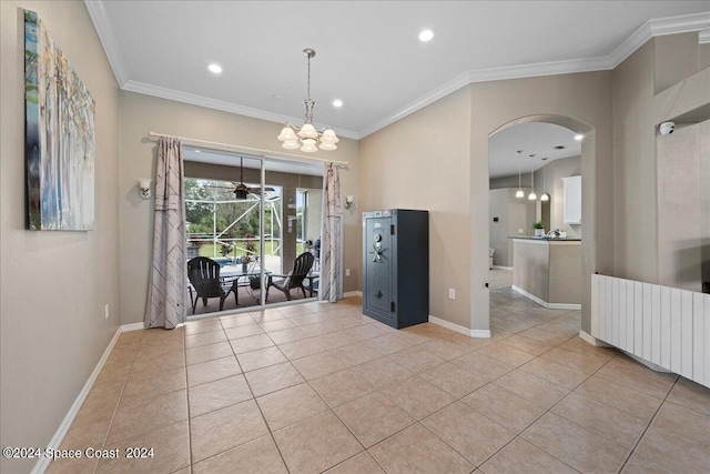 interior space featuring radiator heating unit, ornamental molding, and a notable chandelier