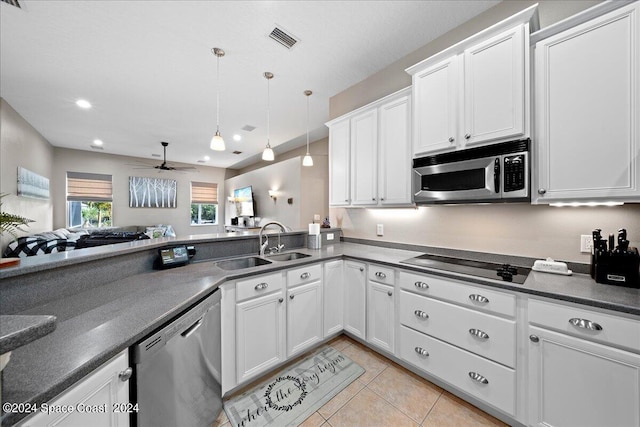 kitchen featuring white cabinets, decorative light fixtures, stainless steel appliances, and ceiling fan