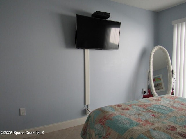 bedroom with light tile patterned floors