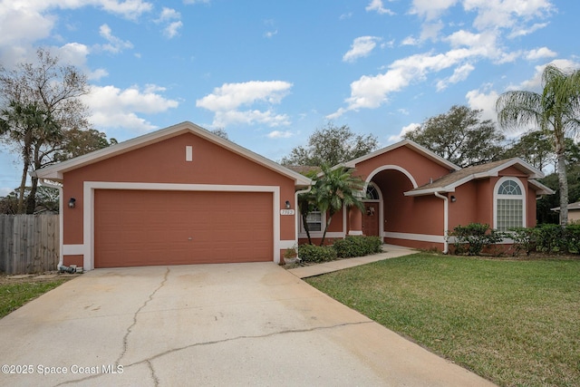 single story home with a garage and a front yard