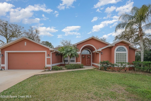 ranch-style house with a garage and a front yard