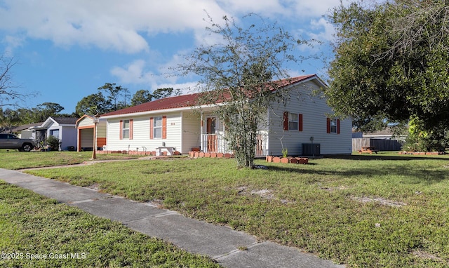 ranch-style home featuring a front yard and central air condition unit