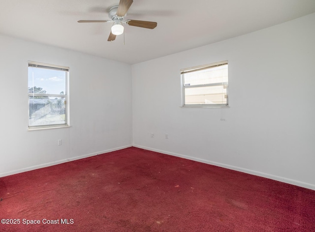 empty room with ceiling fan, carpet floors, and a healthy amount of sunlight